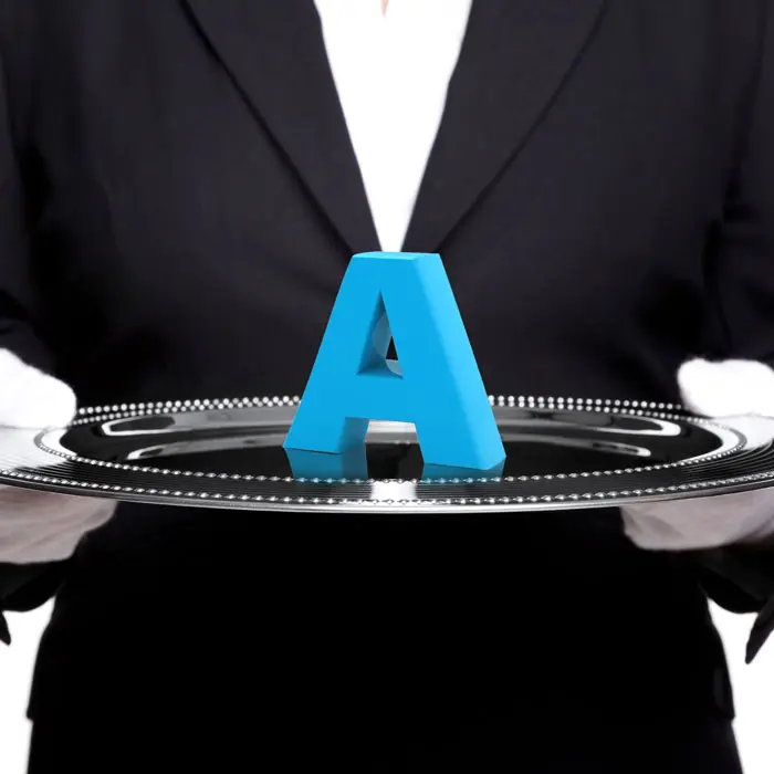 A butler with a letter A on a serving tray
